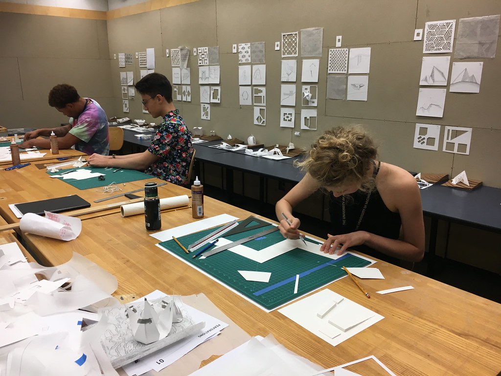 A group of people sitting at a table
Description automatically generated