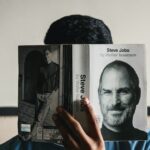 student reading business book