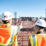 two engineers looking at engineering project