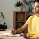 student writing college application essay