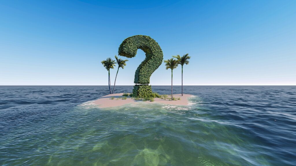 Picture of a large question mark on a deserted island surrounded by the ocean